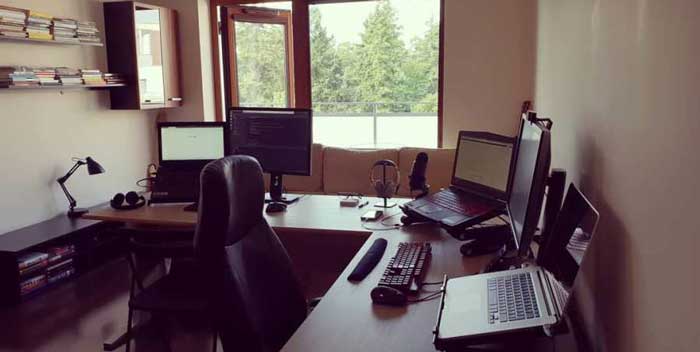 a photo of the laptop, computer table and office chair as a home office set-up