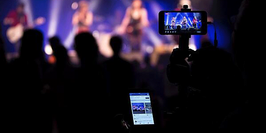 filming a live event using a phone and streaming it onto the phone