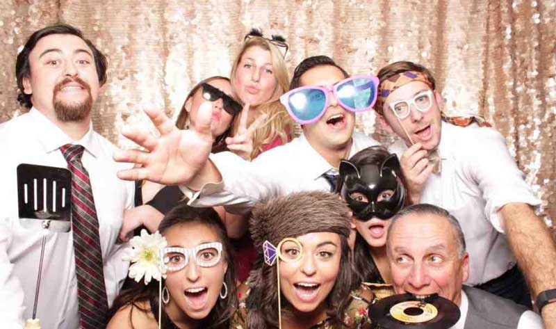 a group posing in a photo booth