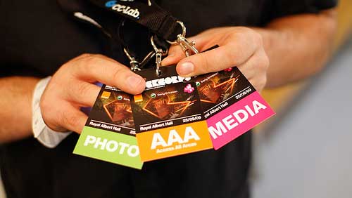 a media man holding passes for events