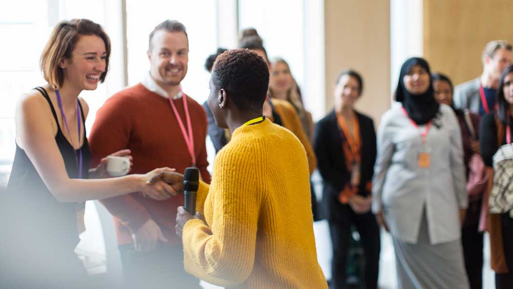 people-talking-and-shaking-hands-at-an-event