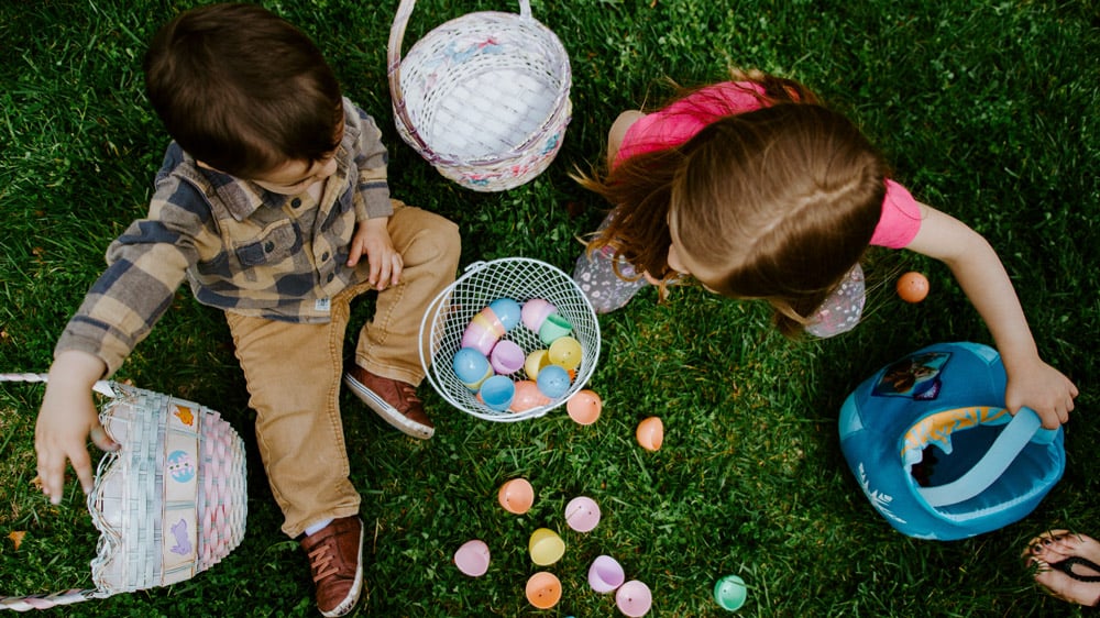 children-looking-at-their-eggs-for-an-easter-hunt-event